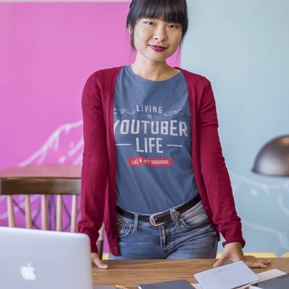 Showing a women wearing the living the youtuber life tee in heather cool blue