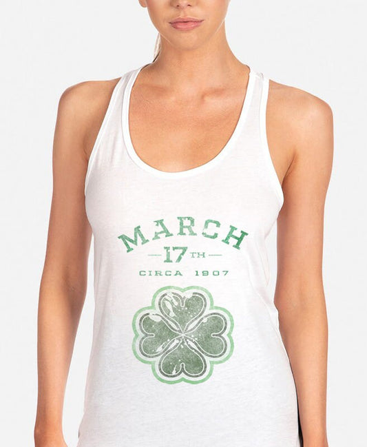 a woman wearing a tank top with a shamrock on it