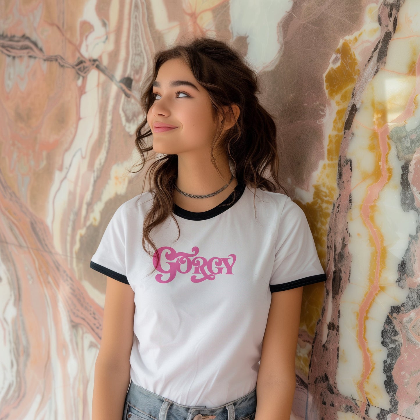 a young girl standing in front of a wall