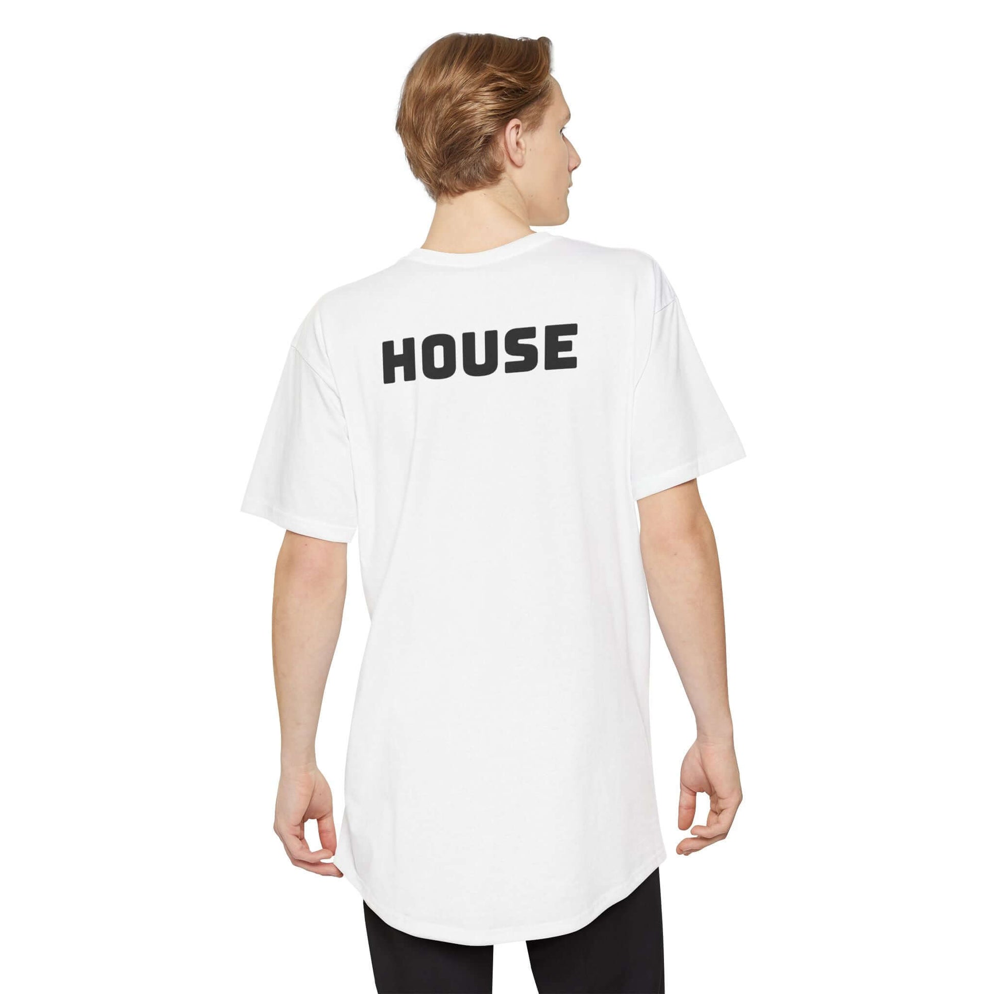 Model wearing the White version of the oversized HOUSE tee from the back, showing the drop-tail 